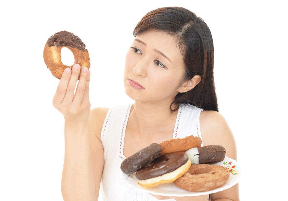 甘い物が気になる女性