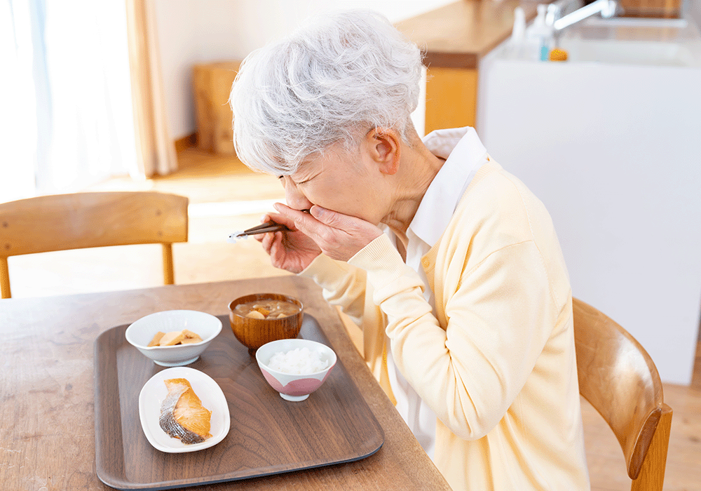 誤嚥する女性